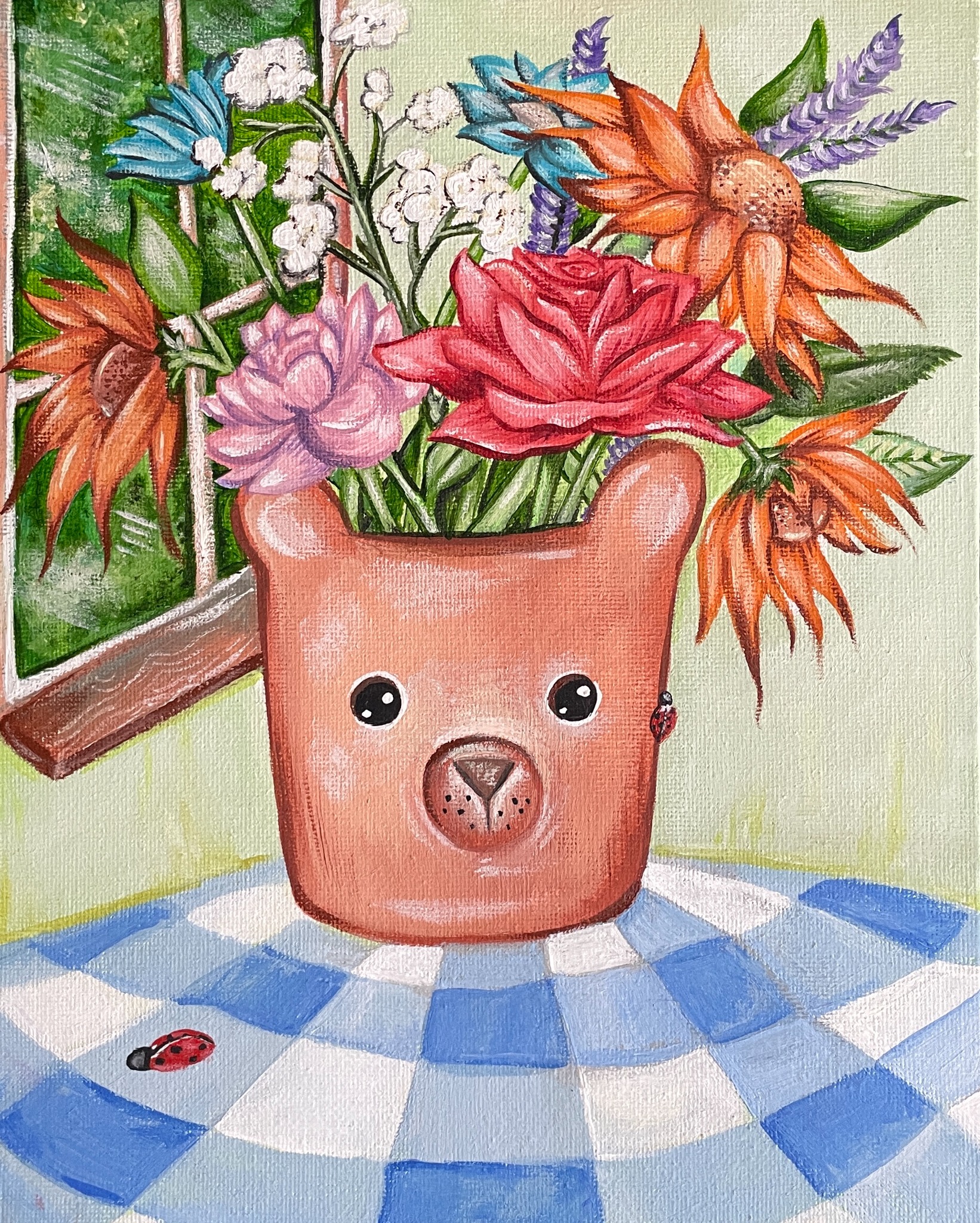 Bear-shaped vase filled with flowers on a blue gingham table